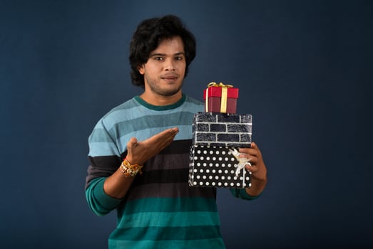 Young men showing Rakhi on his hand with gift box on the occasion of Raksha Bandhan festival photo