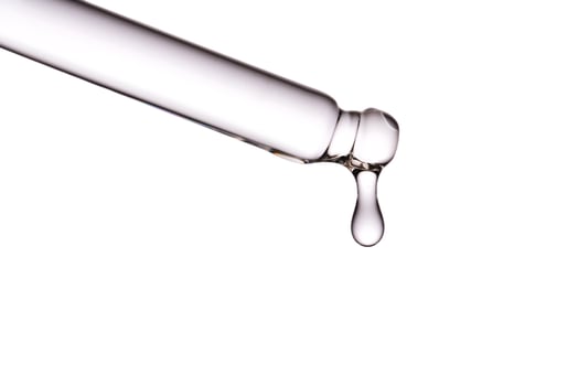 Dropper pipette with delicious serum with bubbles close-up. photo