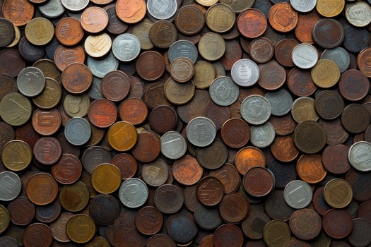 A large pile of coins is shown in this photo