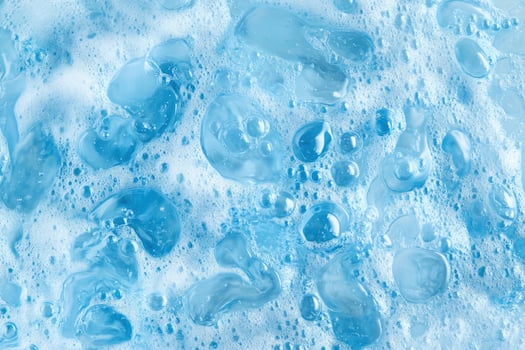 A close up of a blue liquid with bubbles photo
