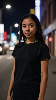 Young African American woman in a black Tshirt amidst a bustling urban nightscape photo