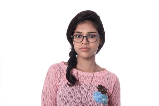 Beautiful young girl posing on white background. photo