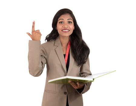 thoughtful woman student, teacher or business lady holding books and showing ok sign on white background photo
