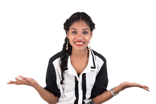 Portrait of beautiful young smiling girl posing on white background photo