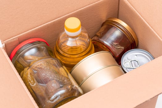 Food Reserves or Donation Box. Carton Box with Canned Food, Cereals and Grocery. Emergency Food Storage in Case of Crisis. Free Social Help, Blessings and Care. Strategic Food Supplies photo