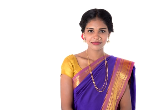 Beautiful Indian young girl posing in traditional Indian saree on white background. photo