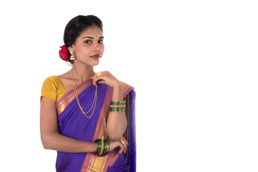 Beautiful Indian young girl posing in traditional Indian saree on white background. photo