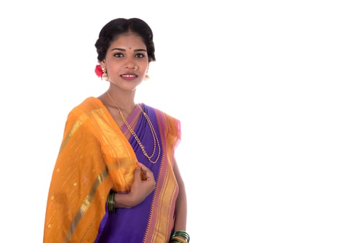 Beautiful Indian young girl posing in traditional Indian saree on white background. photo