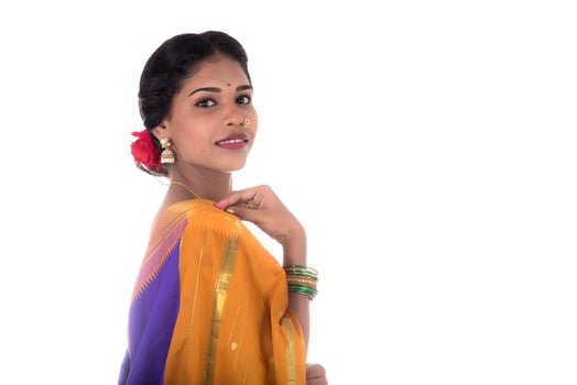 Beautiful Indian young girl posing in traditional Indian saree on white background. photo