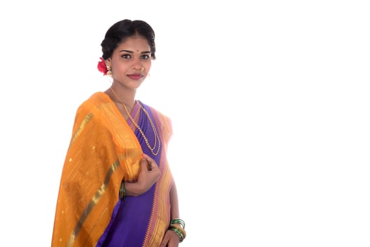 Beautiful Indian young girl posing in traditional Indian saree on white background. photo