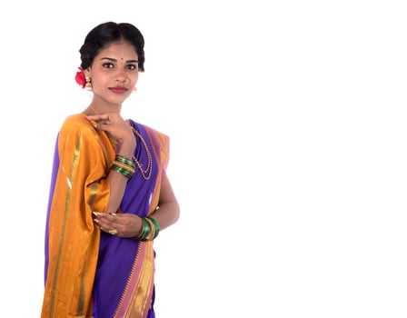 Beautiful Indian young girl posing in traditional Indian saree on white background. photo
