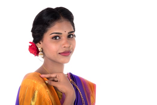 Beautiful Indian young girl posing in traditional Indian saree on white background. photo