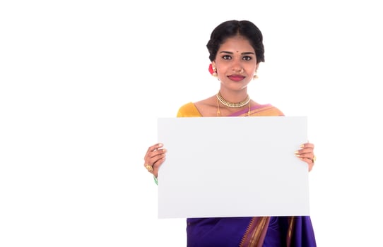 Traditional Girl holding and showing blank white sign board photo