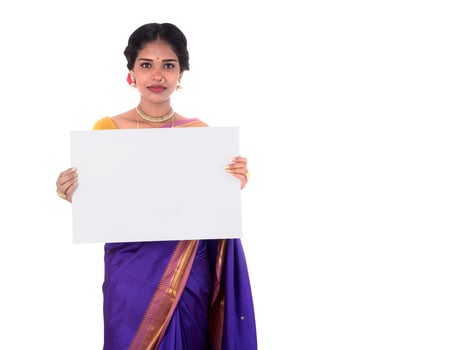 Traditional Girl holding and showing blank white sign board photo