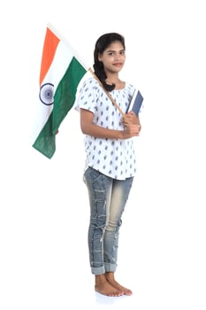 Girl with Indian flag or tricolour and book on white background, Indian Independence day, Indian Republic day photo