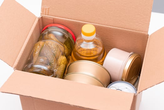 Food Reserves or Donation Box. Carton Box with Canned Food, Cereals and Grocery. Emergency Food Storage in Case of Crisis. Free Social Help, Blessings and Care. Strategic Food Supplies photo