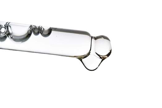 Dropper pipette with delicious serum with bubbles close-up. photo