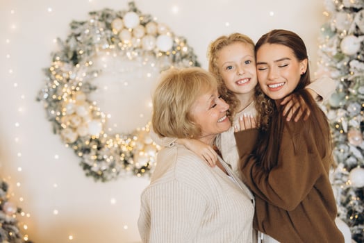 Three Generations Smiling Together at Christmas Celebration photo