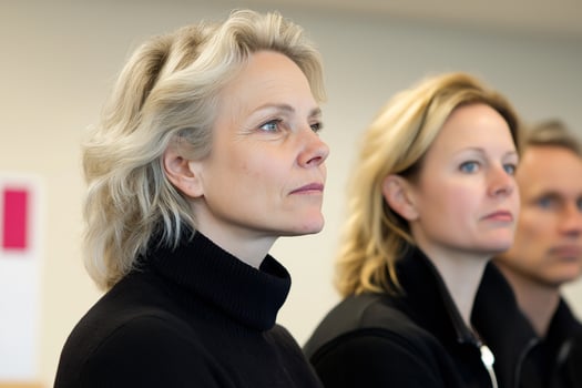 Engaged mixed team members listening attentively during a collaborative meeting in a modern office photo