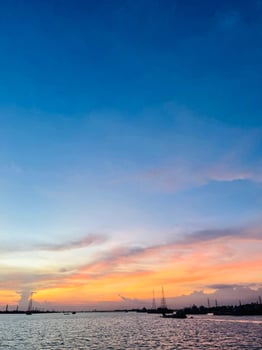 Aerial view to sunset on the river at summer evening with cloudy sky. photo