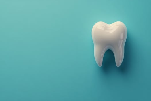 A detailed view of a healthy human tooth on a blue background showcasing dental anatomy clearly photo