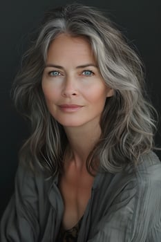A woman with layered hair and electric blue eyes smiles for portrait photography photo