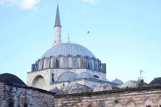 The stunning and majestic mosque dome beautifully shines under the clear blue sky in Istanbul photo