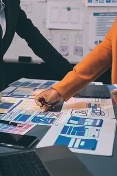The designer team is designing the uxui system to make the uxui system work well on new phones and support system updates. Website development concept UI UX front end designer photo