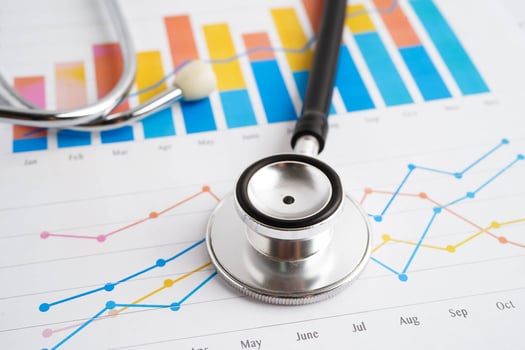 Stethoscope on chart or graph paper, Financial, account, statistics and business data medical health. photo