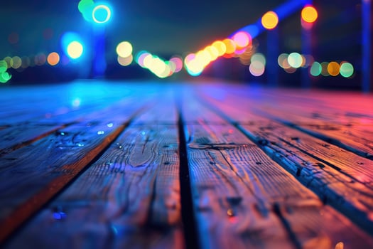 Defocused city lights create a colorful bokeh effect on a wooden boardwalk at night. photo