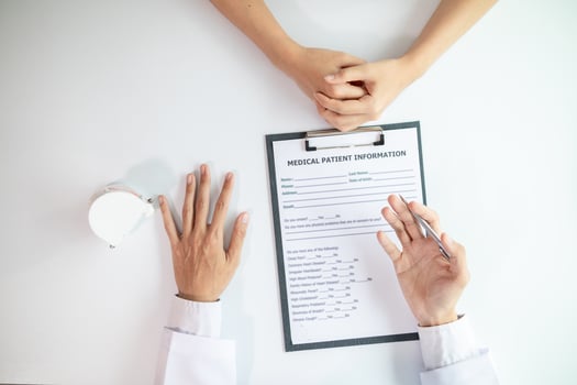 woman consults dentist about her toothache for treatment in dental clinic and dentist gives advice on right symptoms and treatment method for patient. concept consulting dentist about dental treatment photo