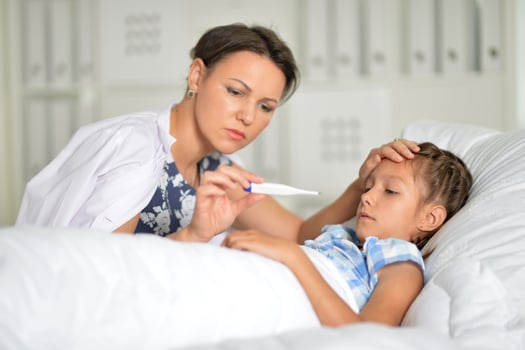 A little girl with her mother in the hospital photo