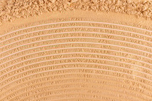 Beautiful texture of dry loose powder in a natural tone. cosmetic abstract background for design. top view. A copy space. layout. photo