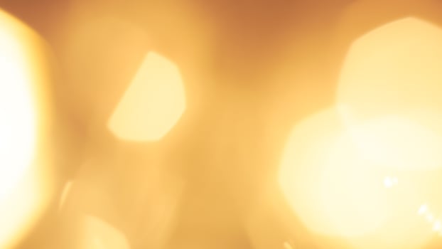 Golden bokeh festive lights with a soft, warm glow creating a cheerful atmosphere photo