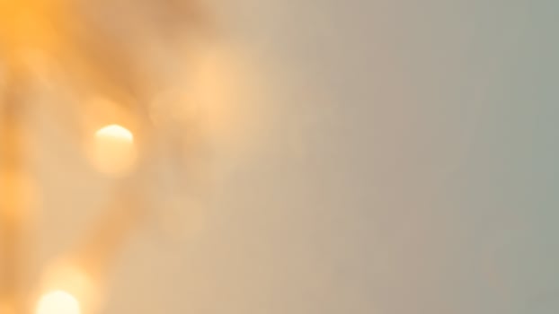 Golden bokeh festive lights with a soft, warm glow creating a cheerful atmosphere photo