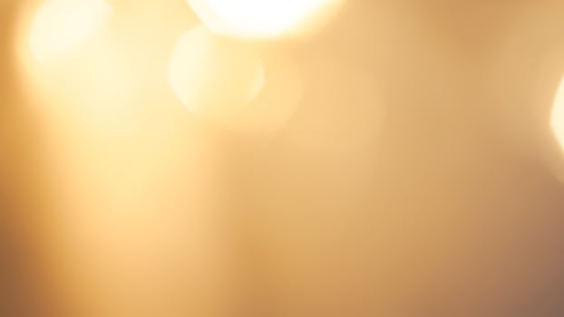 Bright golden bokeh lights create a vibrant and festive holiday background photo