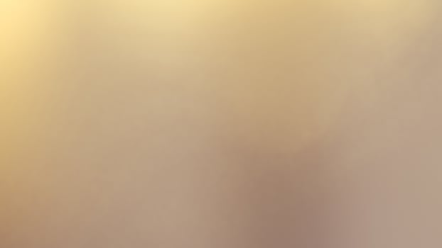 Warm glowing bokeh lights in a golden festive background for holiday celebrations photo
