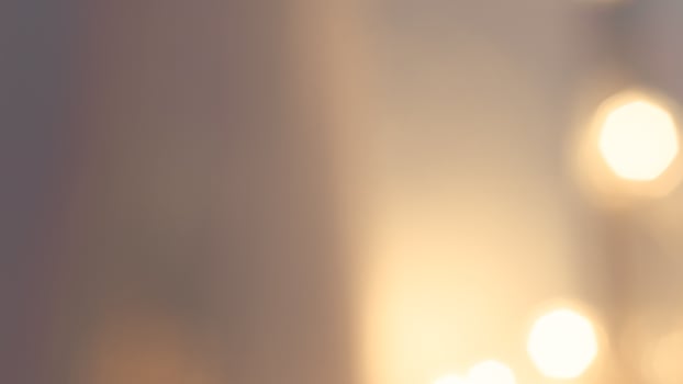Golden bokeh lights with a soft and elegant glow, perfect for holiday celebrations photo