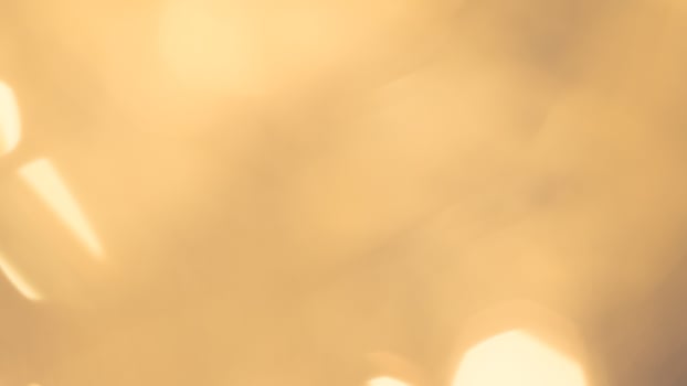 Bright golden bokeh lights create a festive and sparkling holiday ambiance photo