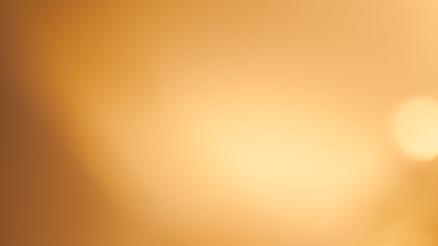 Soft golden bokeh background with a subtle glowing and elegant festive ambiance photo
