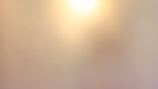 Golden bokeh festive background with soft, twinkling lights and a glowing effect photo