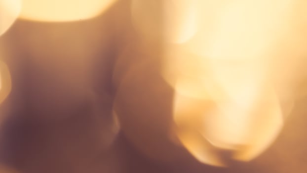Bright golden bokeh lights create a vibrant and festive holiday background photo