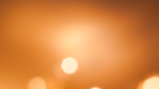 Soft golden bokeh background with a subtle glowing and elegant festive ambiance photo
