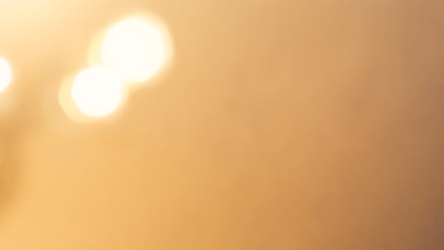 Soft golden bokeh background with a subtle glowing and elegant festive ambiance photo