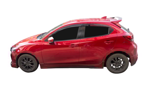 Side view of sports red hatchback car isolated on white background with clipping path photo