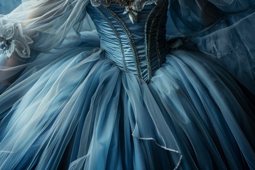 A woman in a blue dress with a tiara photo