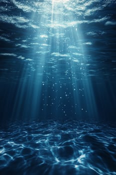 Light rays penetrate clear water creating a serene underwater atmosphere at midday photo