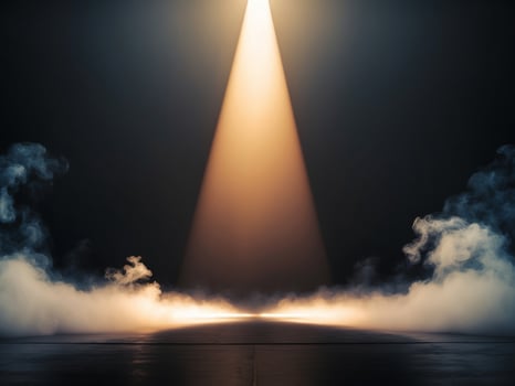 A spotlight shines on a dark stage with smoke photo