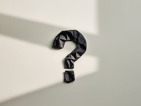 Question mark on white background with shadow photo