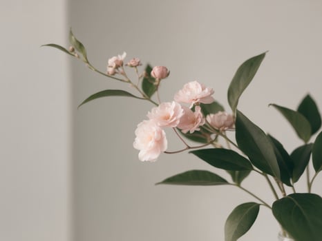 A vase with pink flowers sitting on a table photo